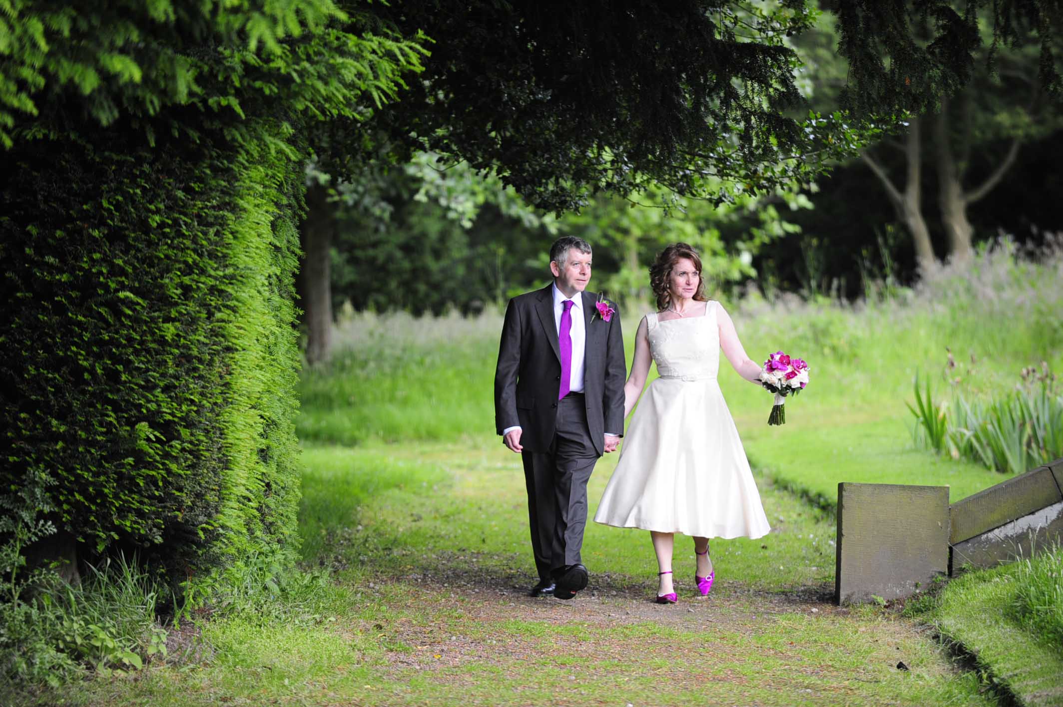 image of a couple walking down a path at Wortley Hall