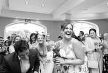 image of girl catching a bouquet at a wedding